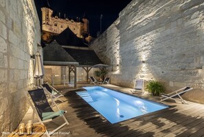 Outdoor pool, open 9:00 AM to 9:00 PM, pool umbrellas, pool loungers
