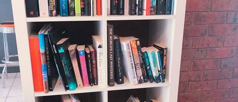 A bookshelf filled with various books.