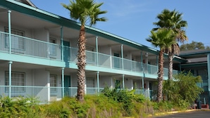 A motel with a two-story structure, multiple balconies, and palm trees. -  Stay Express Inn Near Downtown San Antonio TX (San Antonio)