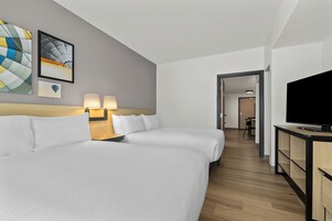 Hypo-allergenic bedding, desk, laptop workspace, blackout curtains