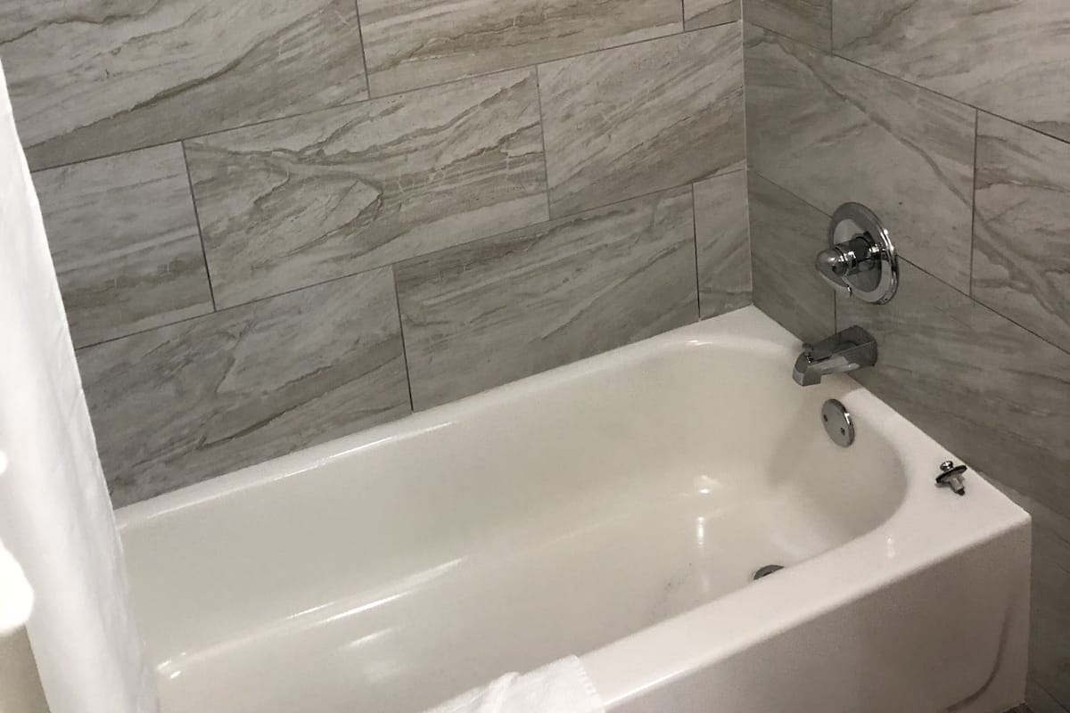 standard room, 2 queen beds, non smoking | bathroom | combined shower/bathtub, hair dryer, towels