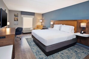 A hotel room with a large bed, a desk, a chair, a TV, and a window. - Hampton Inn & Suites Spartanburg-I-26-Westgate Mall (Spartanburg)