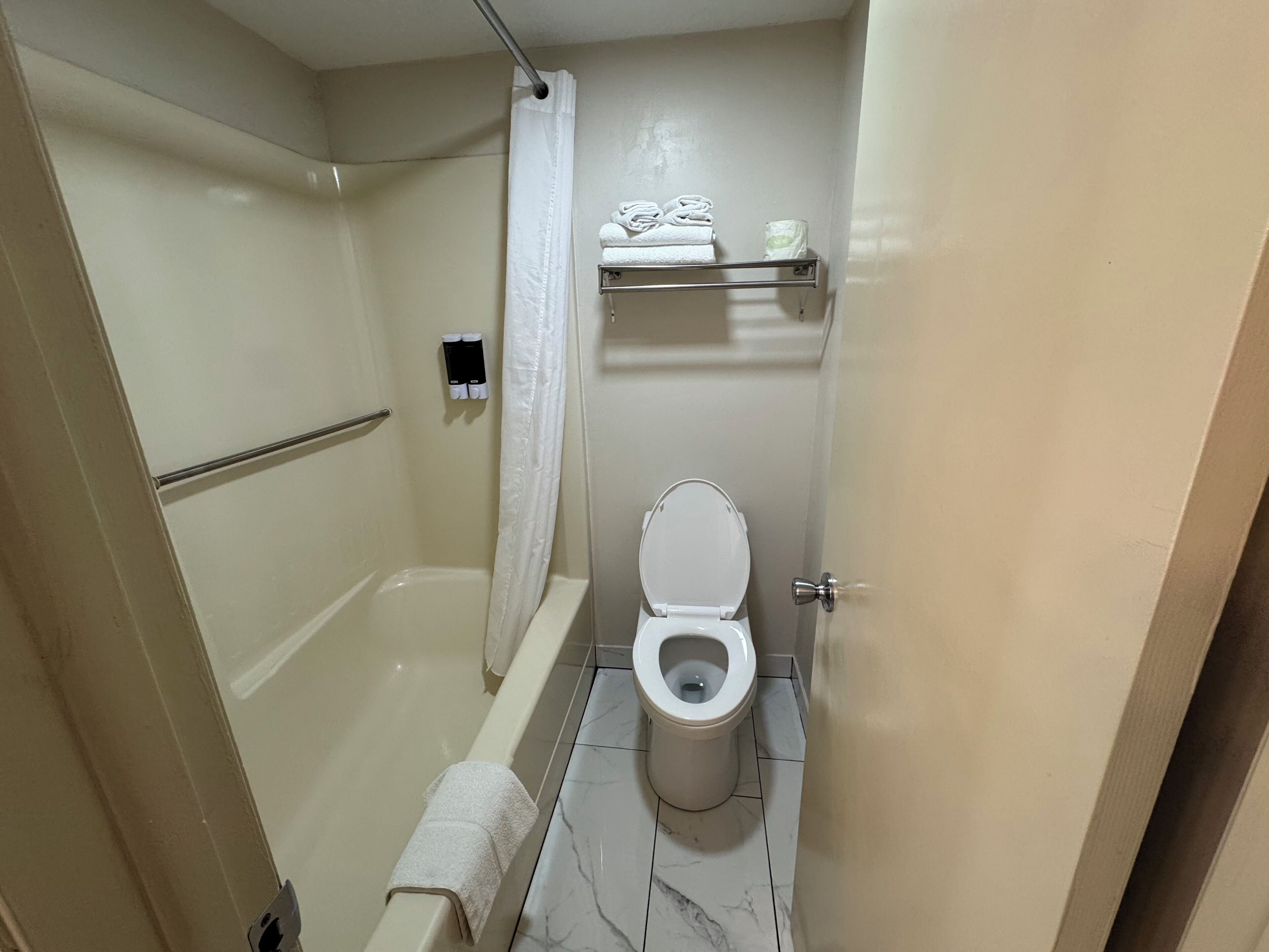 deluxe double room, 2 queen beds, refrigerator & microwave | bathroom | combined shower/bathtub, eco-friendly toiletries, hair dryer, towels