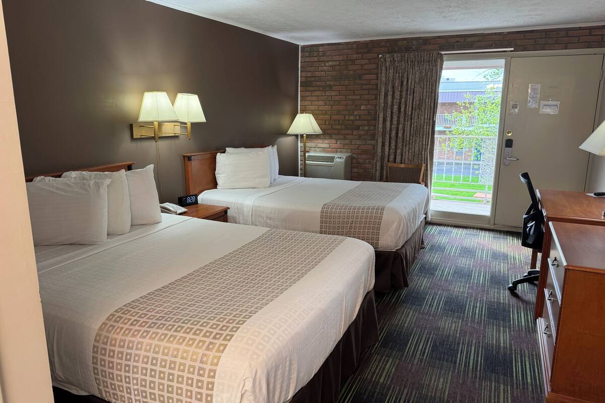 deluxe double room, 2 queen beds, refrigerator & microwave | desk, iron/ironing board, free cots/infant beds, free wifi