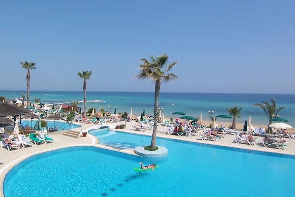 Indoor pool, seasonal outdoor pool, pool umbrellas, sun loungers