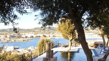 Seasonal outdoor pool, open 10:00 AM to 6:00 PM, pool umbrellas