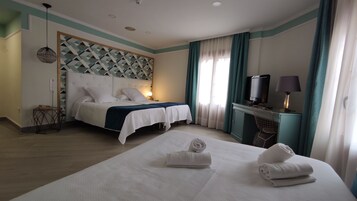 Family Room | Minibar, in-room safe, desk, iron/ironing board