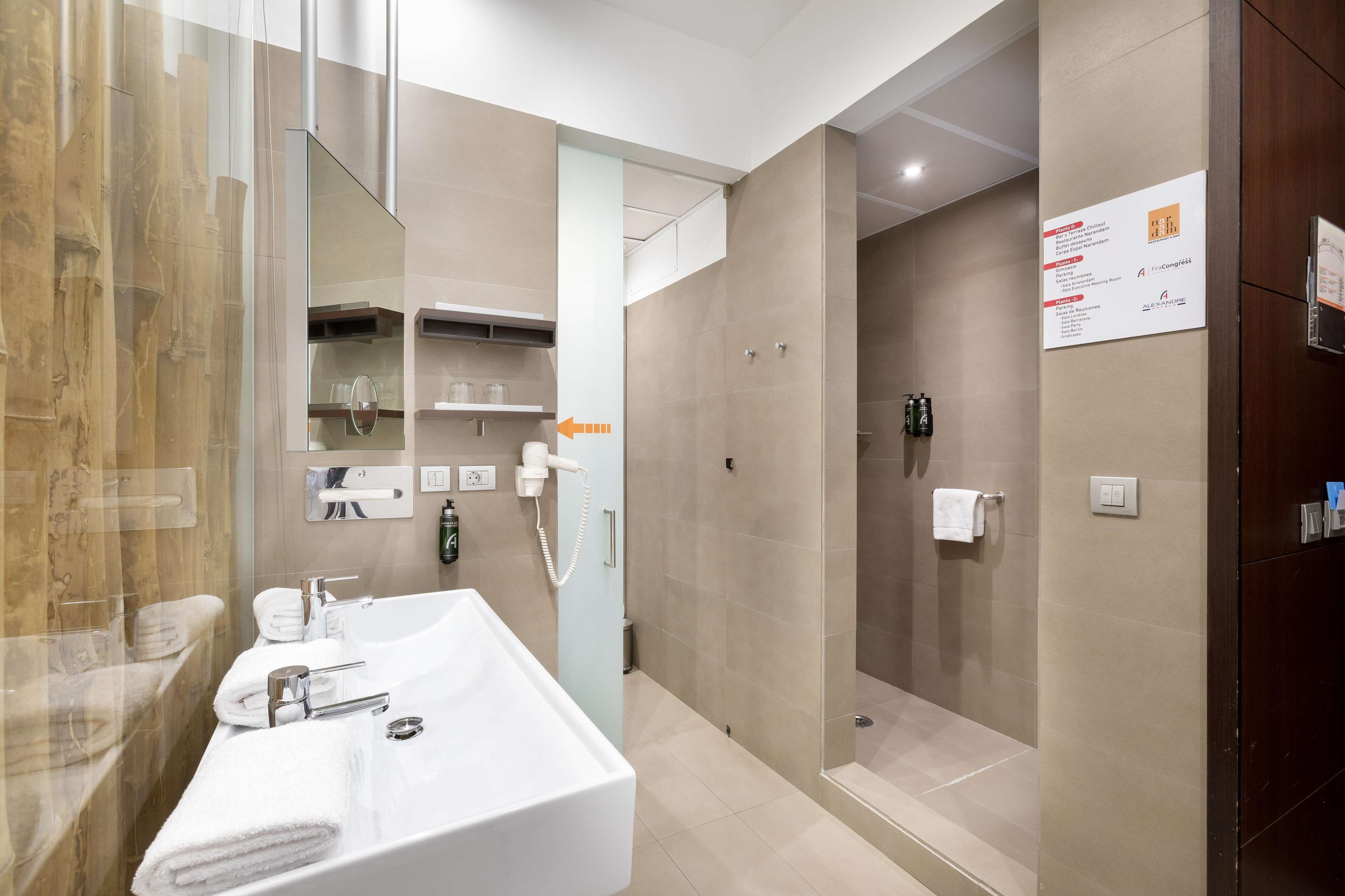 shower, rainfall showerhead, hair dryer, towels