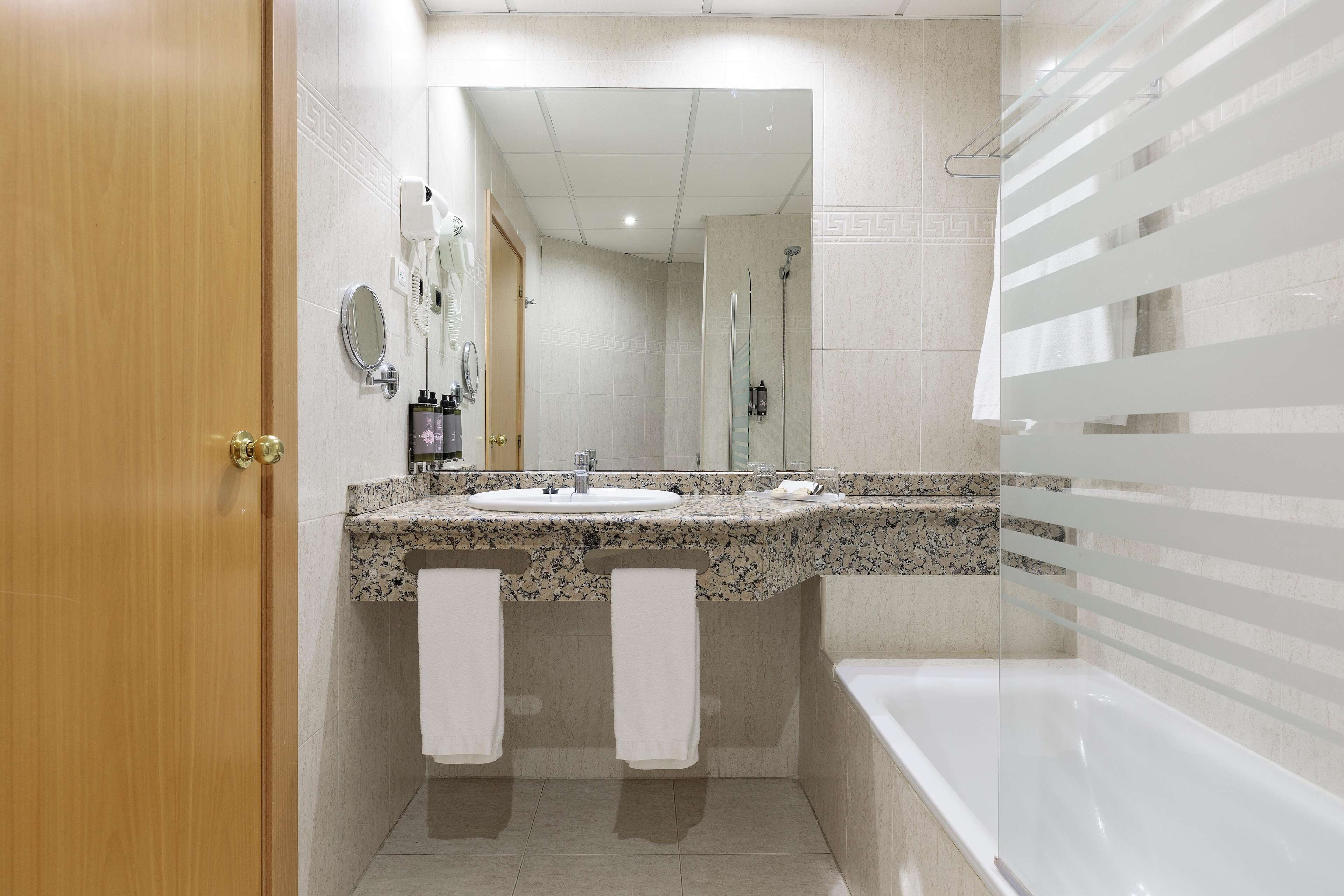 hair dryer, bidet, towels