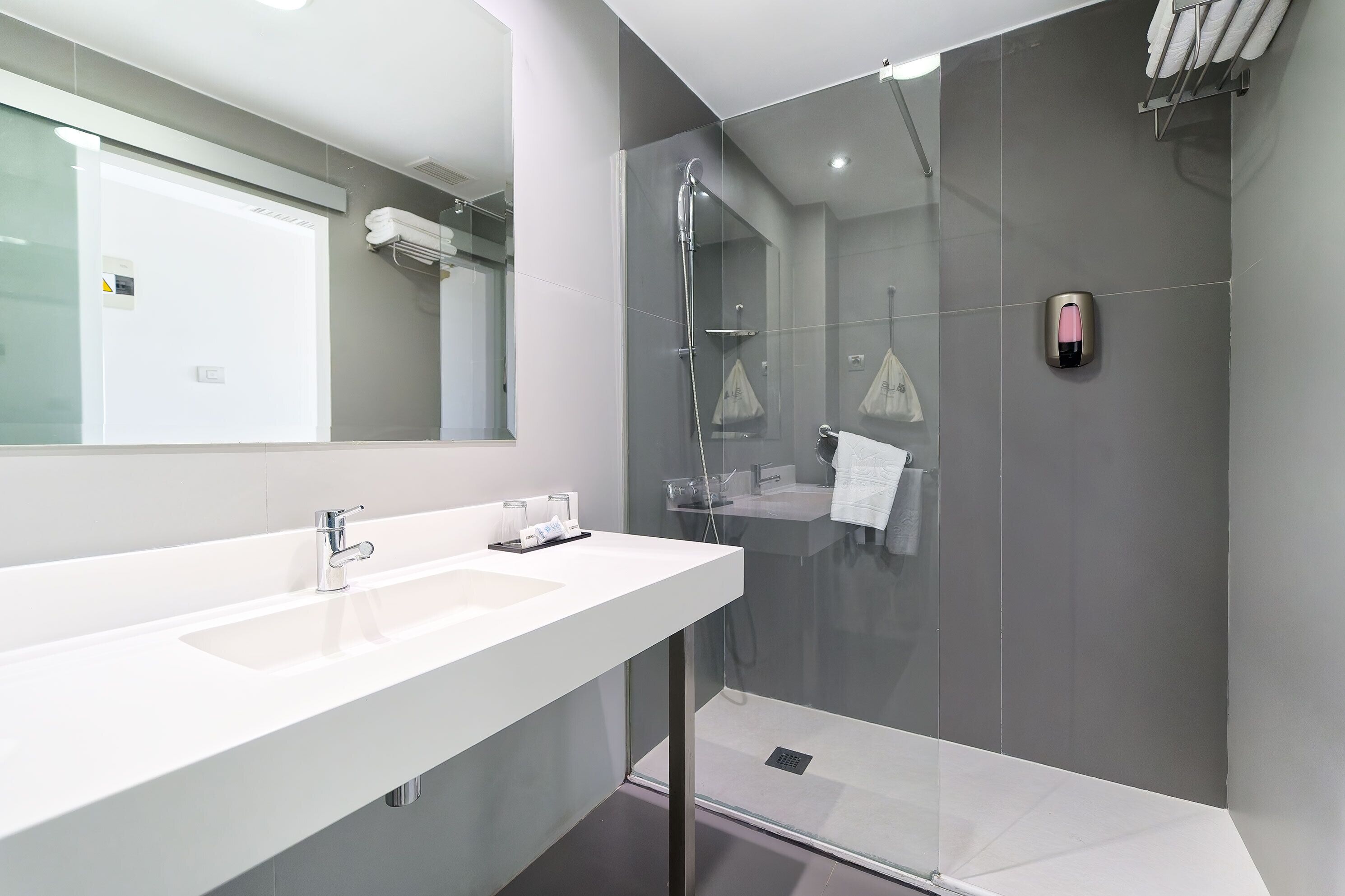 shower, free toiletries, hair dryer, towels