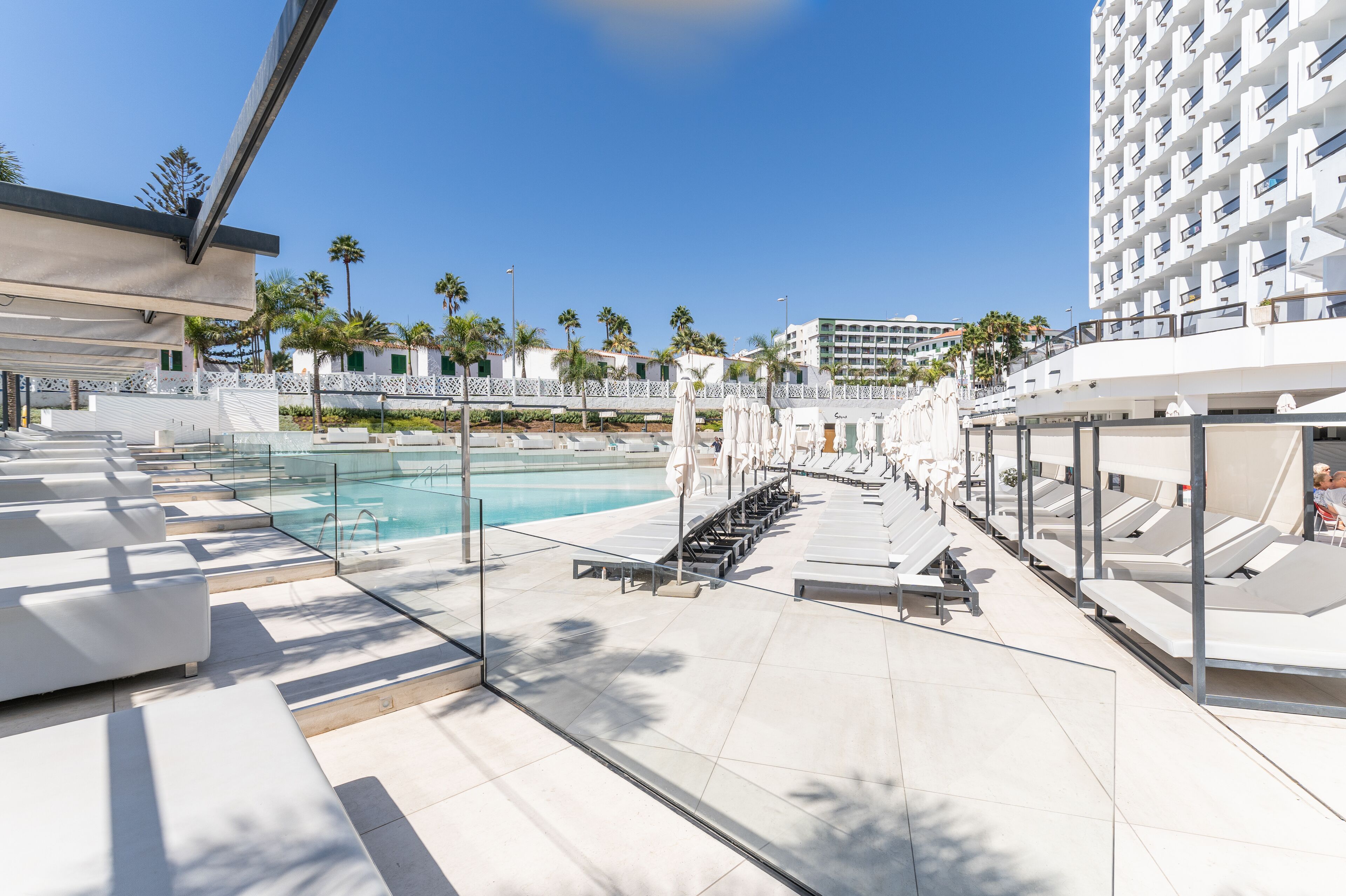 outdoor pool, pool umbrellas, pool loungers