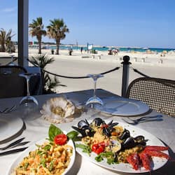 Breakfast, dinner, brunch served; beach views