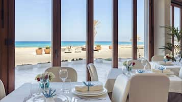 Breakfast, dinner, brunch served; beach views