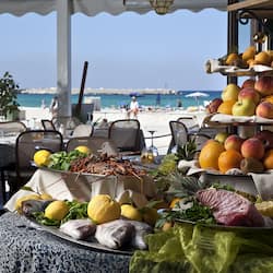 Breakfast, dinner, brunch served; beach views