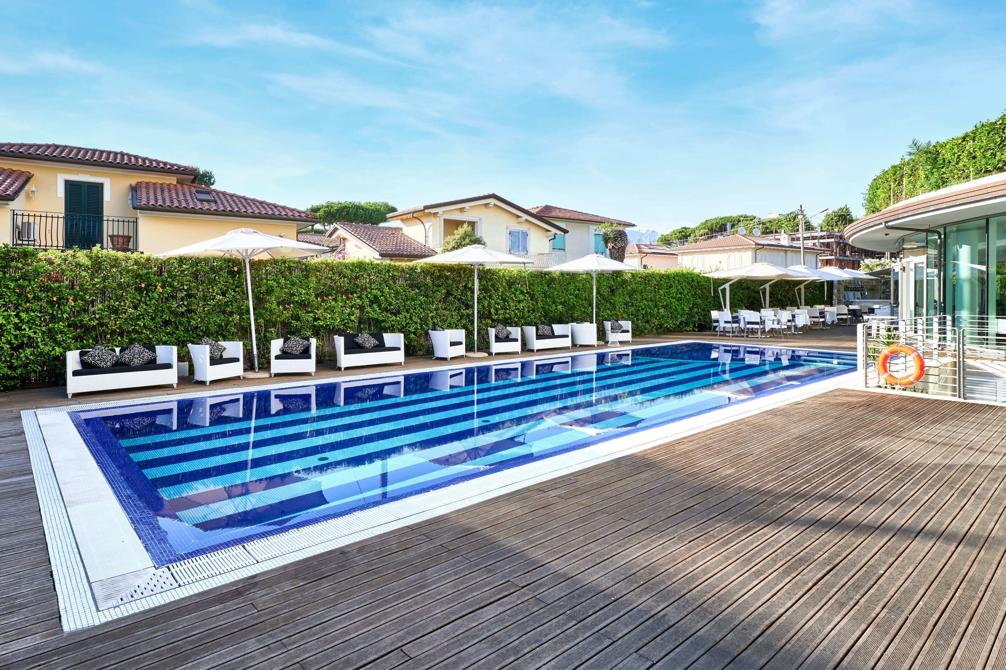 outdoor pool, pool umbrellas, pool loungers