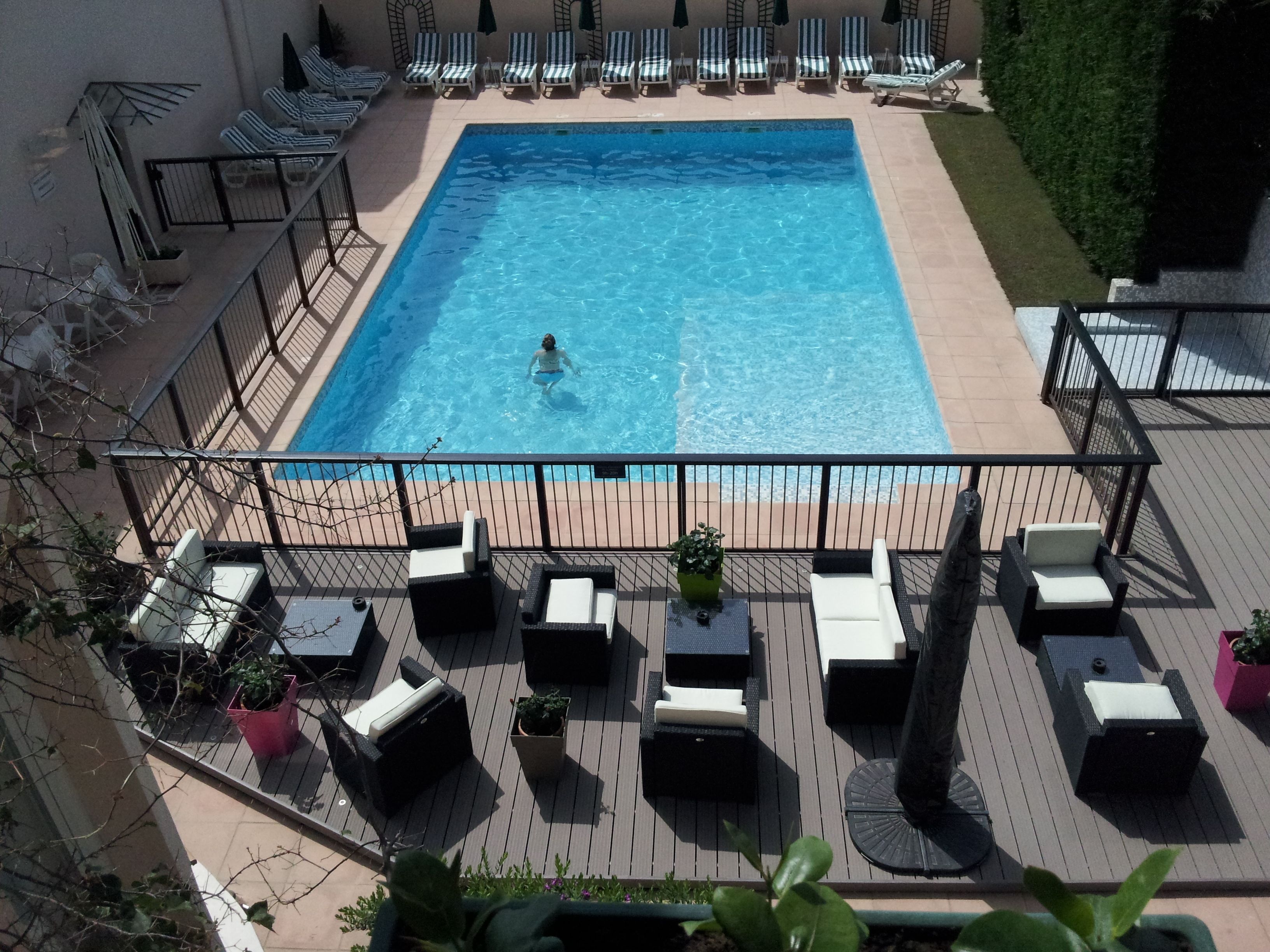 outdoor pool, pool umbrellas, pool loungers