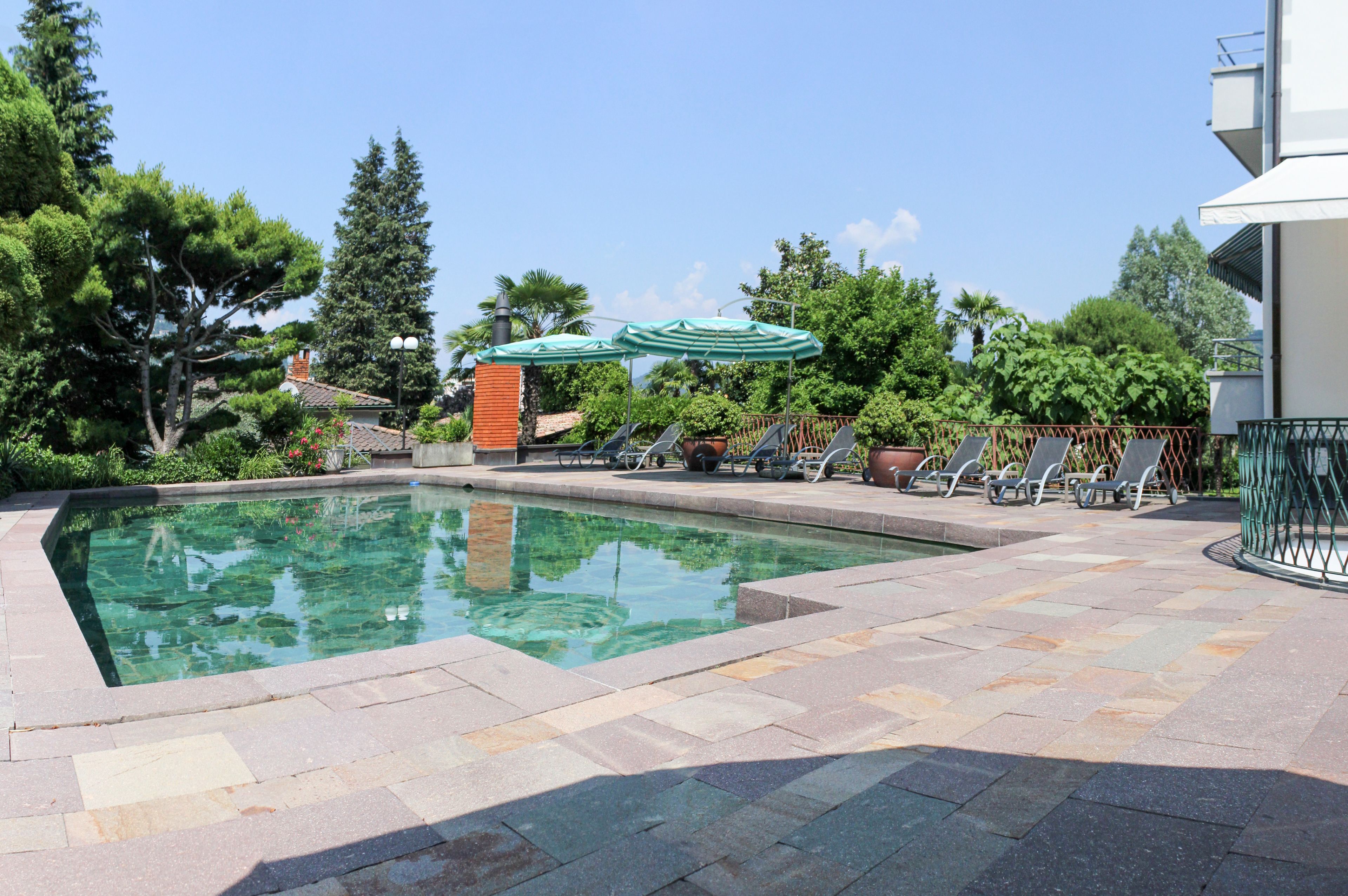 outdoor pool, pool umbrellas, pool loungers