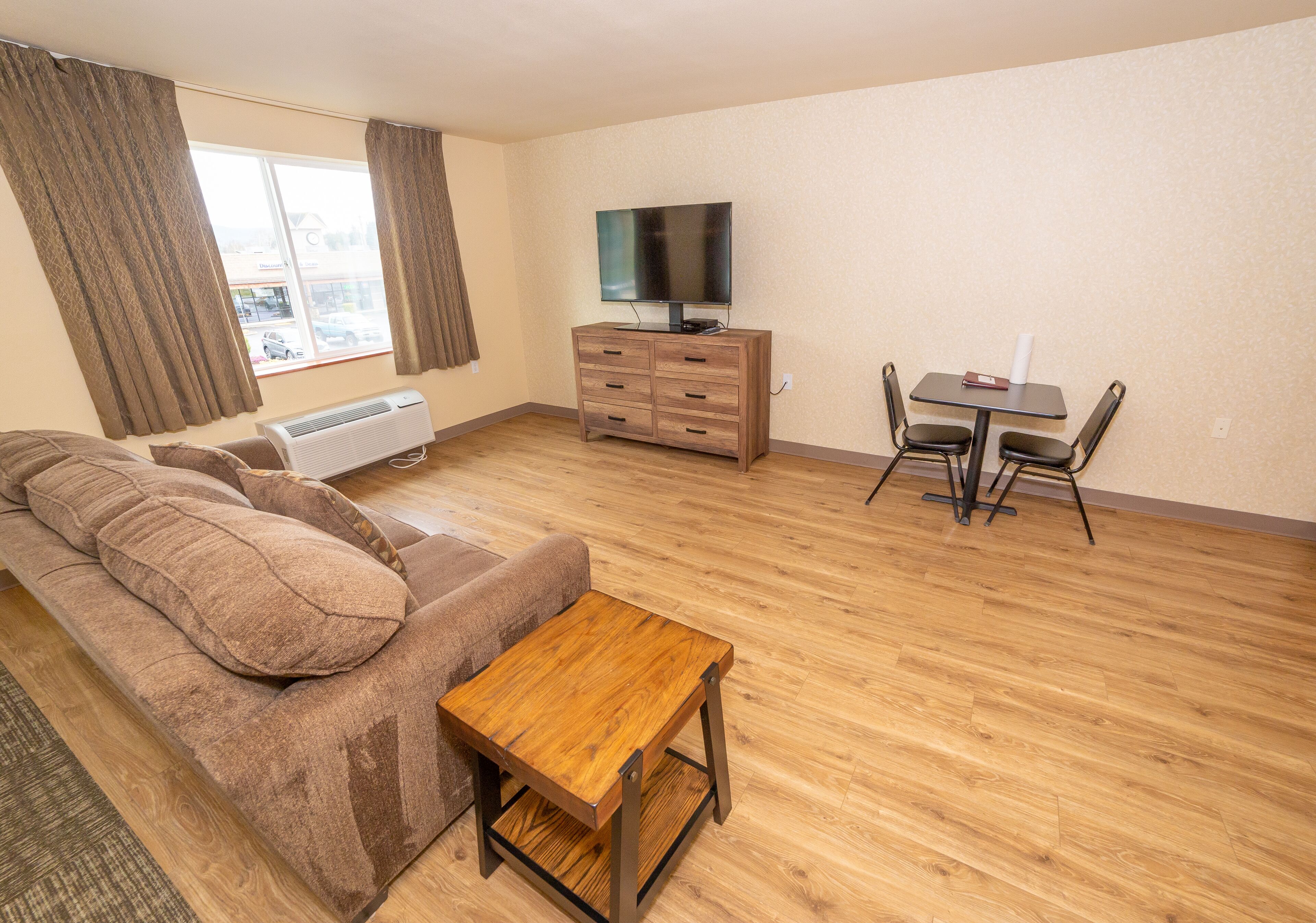 basic room | desk, laptop workspace, blackout curtains, iron/ironing board