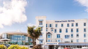 A multi-story building with the name "Hermitage Hotel" on the facade. - Hermitage Hotel OCEANA COLLECTION (Bournemouth)