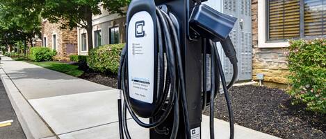 An electric vehicle charging station with a label indicating it is a high-power charger.