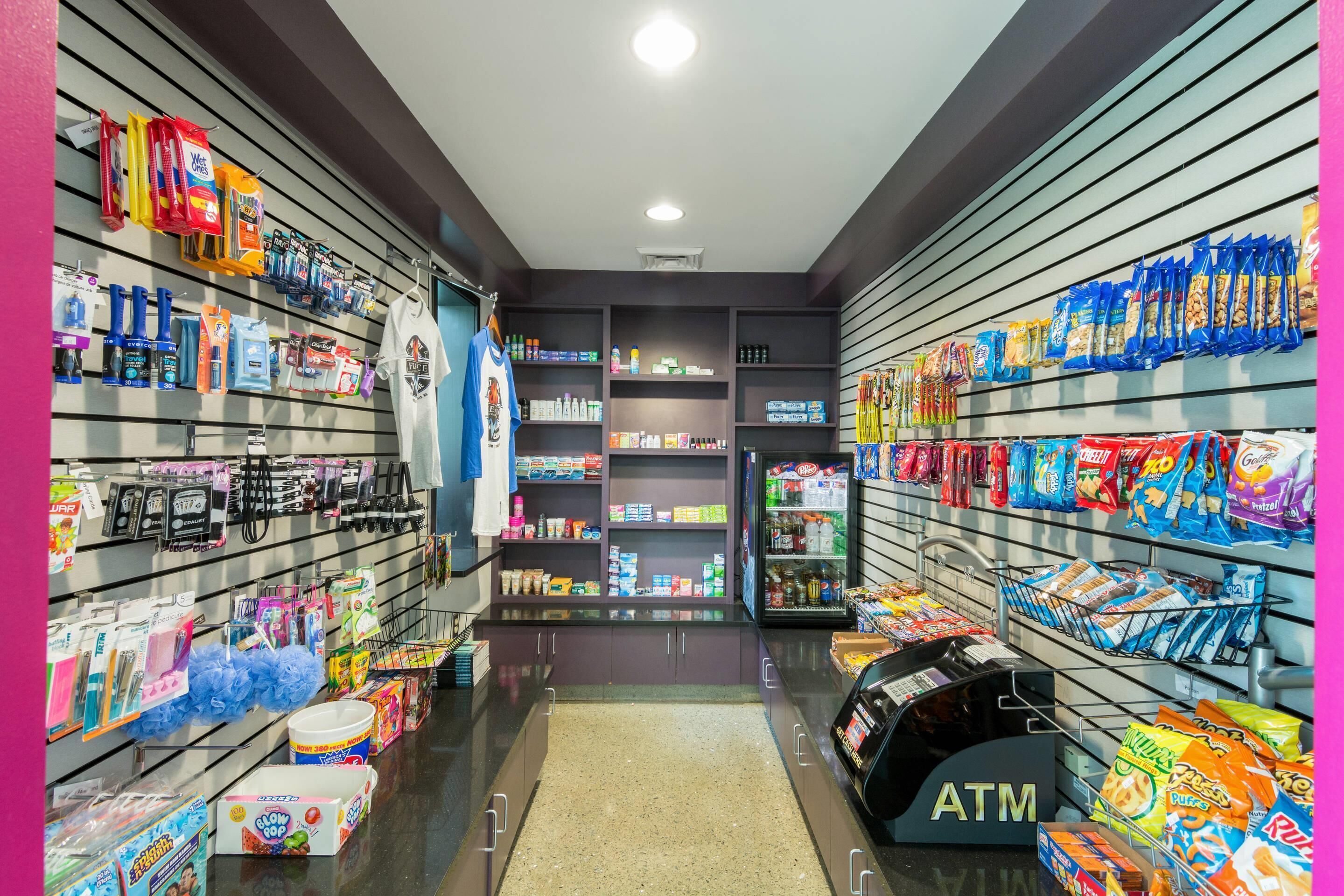 A store with shelves stocked with snacks, toiletries, and other items.