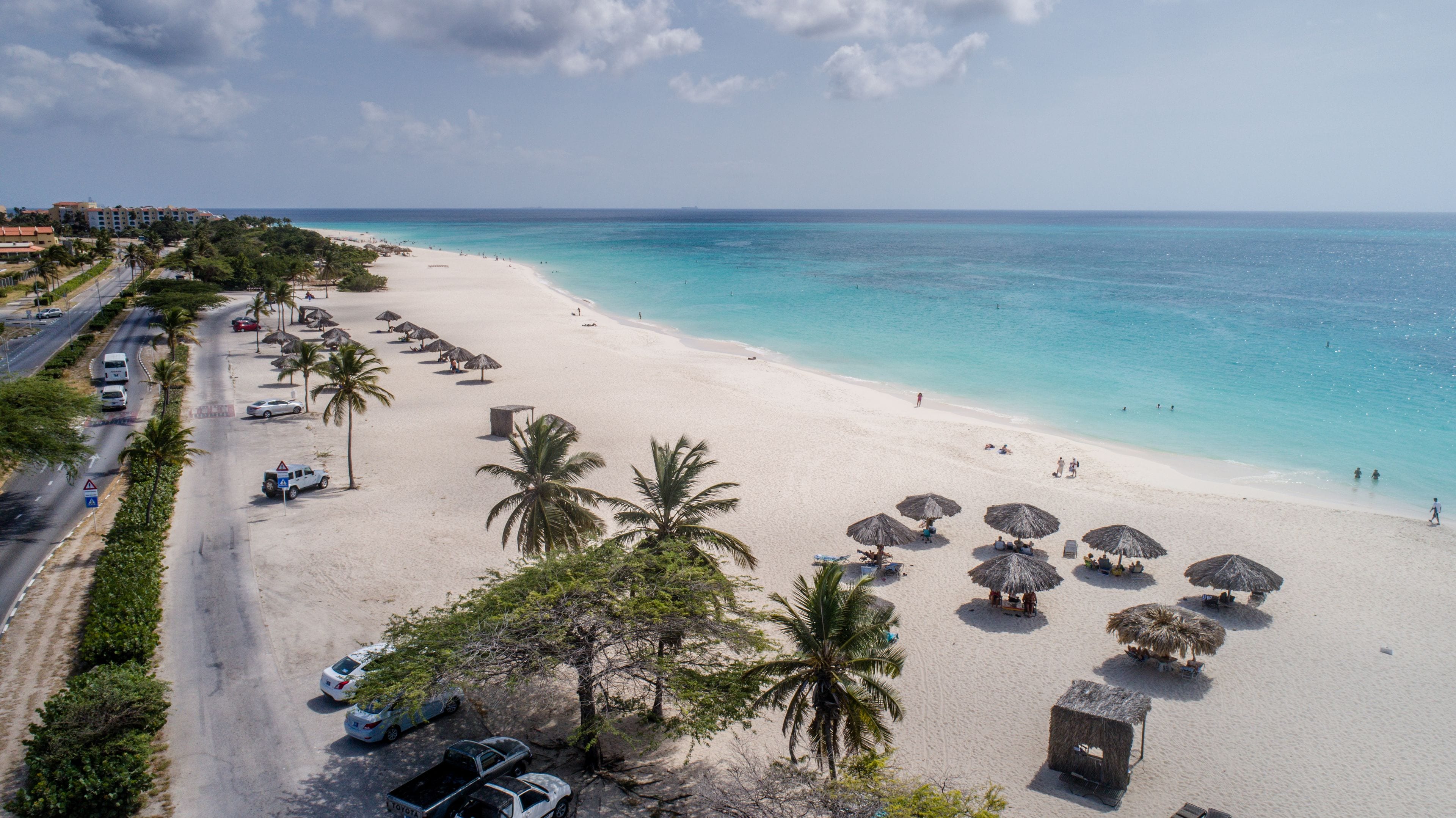 on the beach, white sand, free beach cabanas, sun-loungers