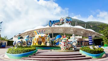 A colorful entrance with a sign that reads "Ocean Park Hong Kong."