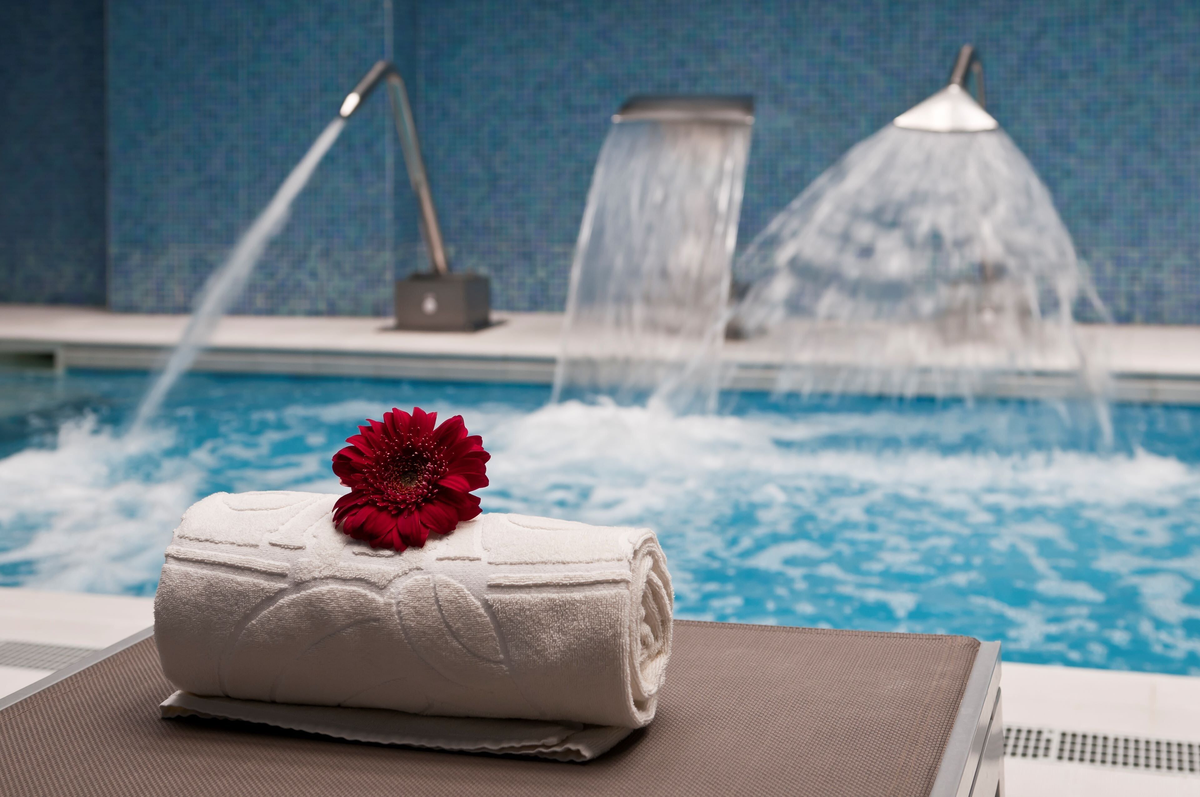 Indoor pool, open 10:00 AM to 7:00 PM, pool loungers