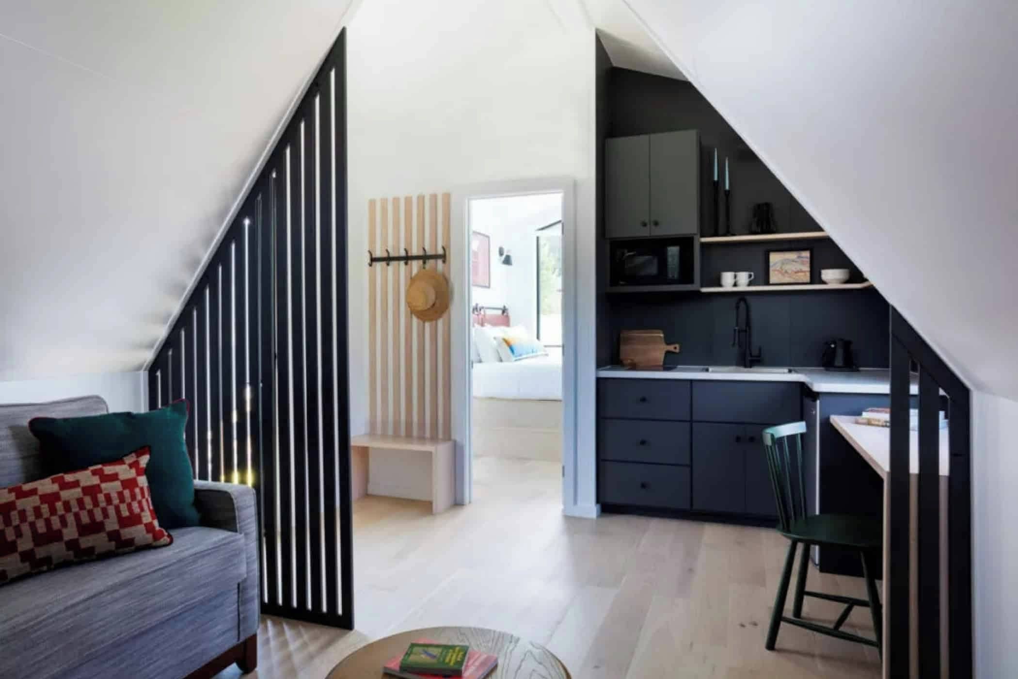 A modern interior with a kitchen, dining area, and living space.