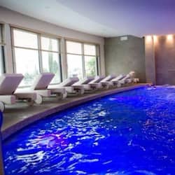 Indoor pool, seasonal outdoor pool, pool umbrellas, pool loungers
