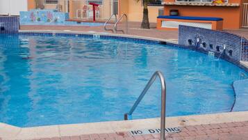 Outdoor pool, open 8:00 AM to 11:00 PM, free pool cabanas