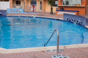 Outdoor pool, open 8:00 AM to 11:00 PM, free pool cabanas