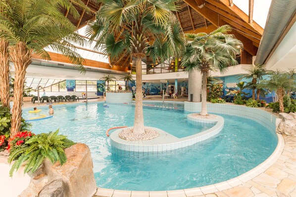 Indoor pool, outdoor pool, pool umbrellas, pool loungers