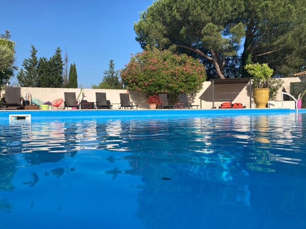 Outdoor pool, open 9:00 AM to 7:30 PM, pool loungers