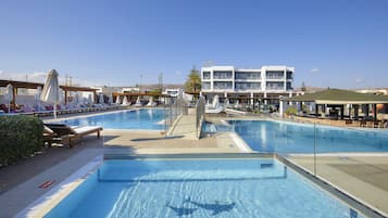Seasonal outdoor pool, open 8:00 AM to 7:00 PM, pool umbrellas