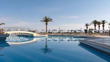 Indoor pool, seasonal outdoor pool, pool umbrellas, pool loungers