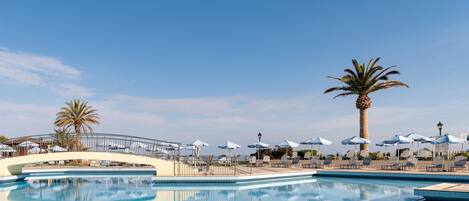 Indoor pool, seasonal outdoor pool, pool umbrellas, sun loungers