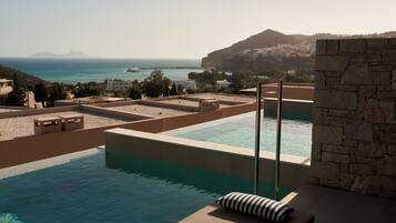 Blue Junior Suite Sea View Private Pool | In-room safe, desk, blackout drapes, bed sheets
