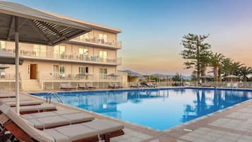 Outdoor pool, open 10 AM to 6:00 PM, pool umbrellas, pool loungers