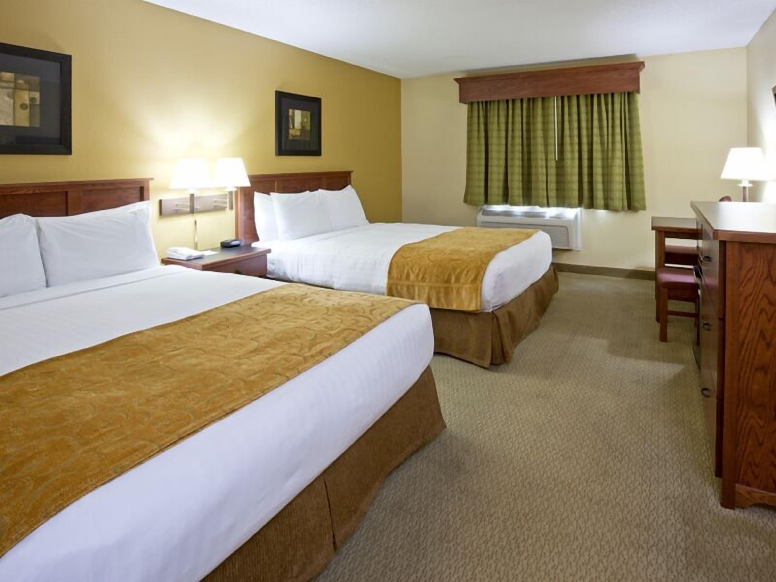 Room, 2 Queen Beds | Individually furnished, desk, laptop workspace, soundproofing