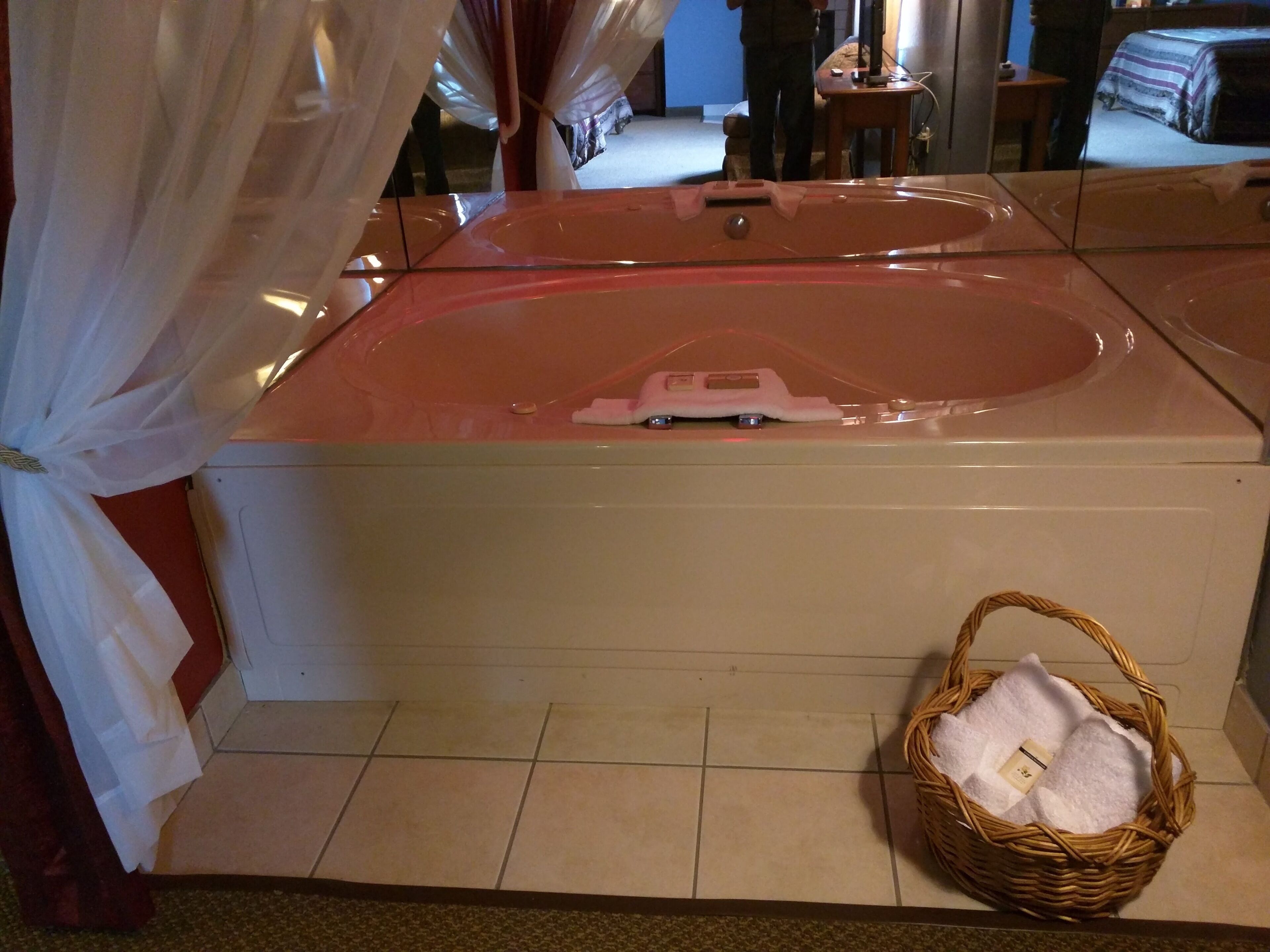 A large, rectangular hot tub with a control panel on the front.