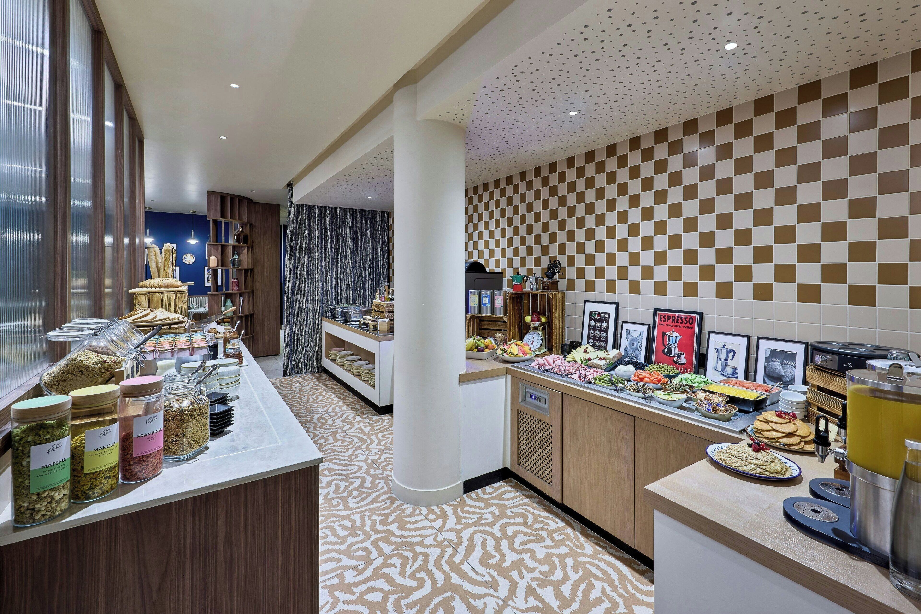 A buffet area with various food items and a coffee station.