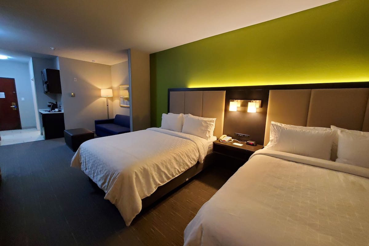 suite, 2 queen beds (additional living area) | desk, iron/ironing board, free rollaway beds, free wifi