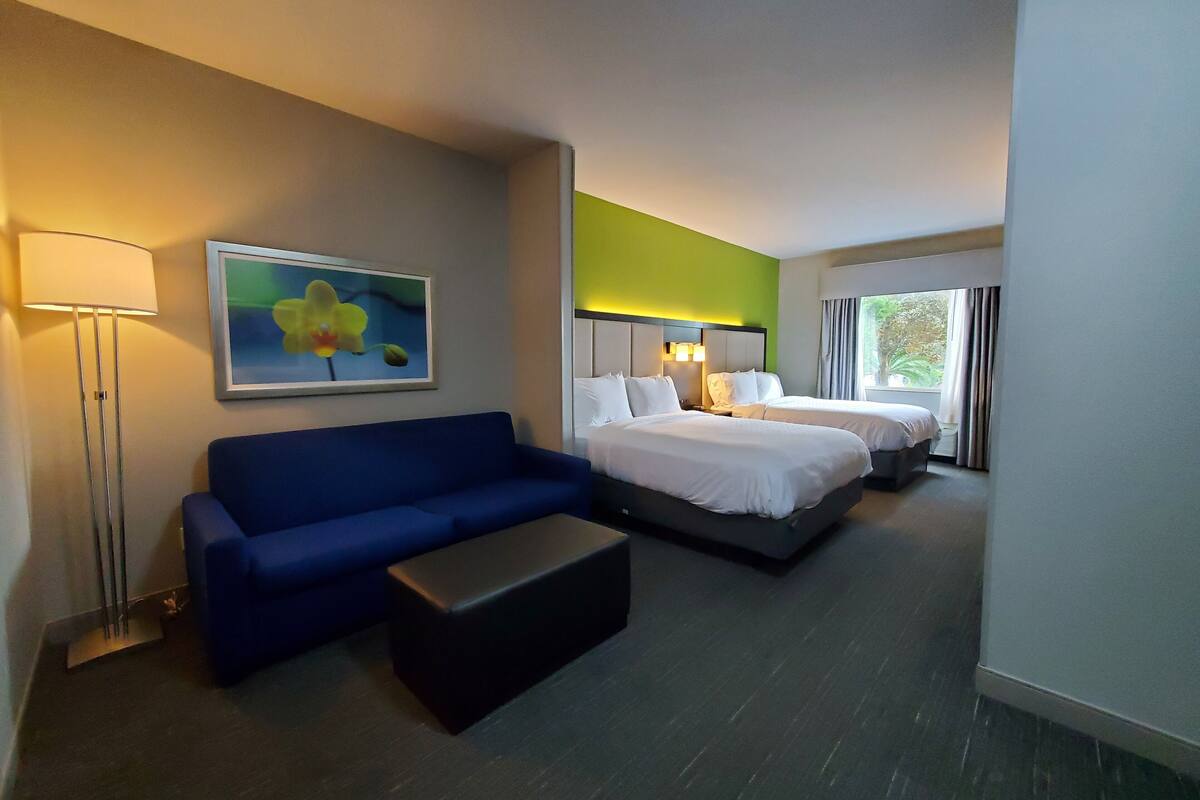 suite, 2 queen beds (additional living area) | desk, iron/ironing board, free rollaway beds, free wifi