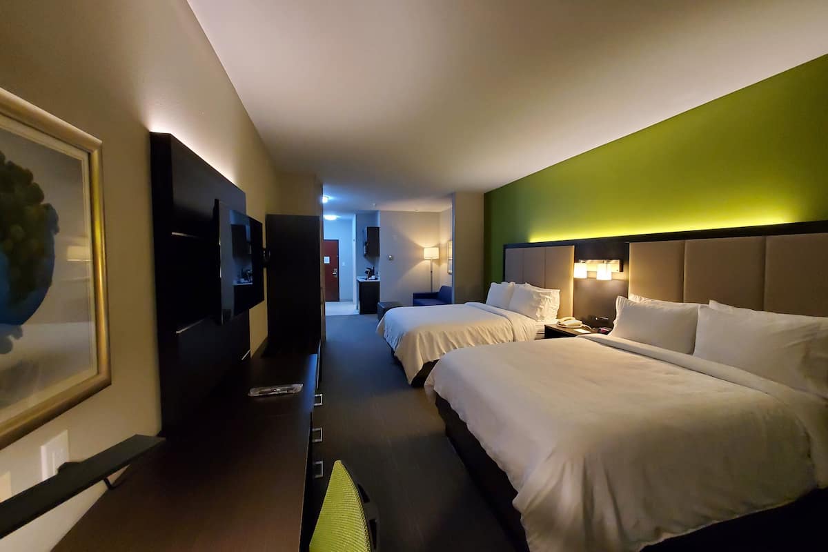 suite, 2 queen beds (additional living area) | desk, iron/ironing board, free rollaway beds, free wifi