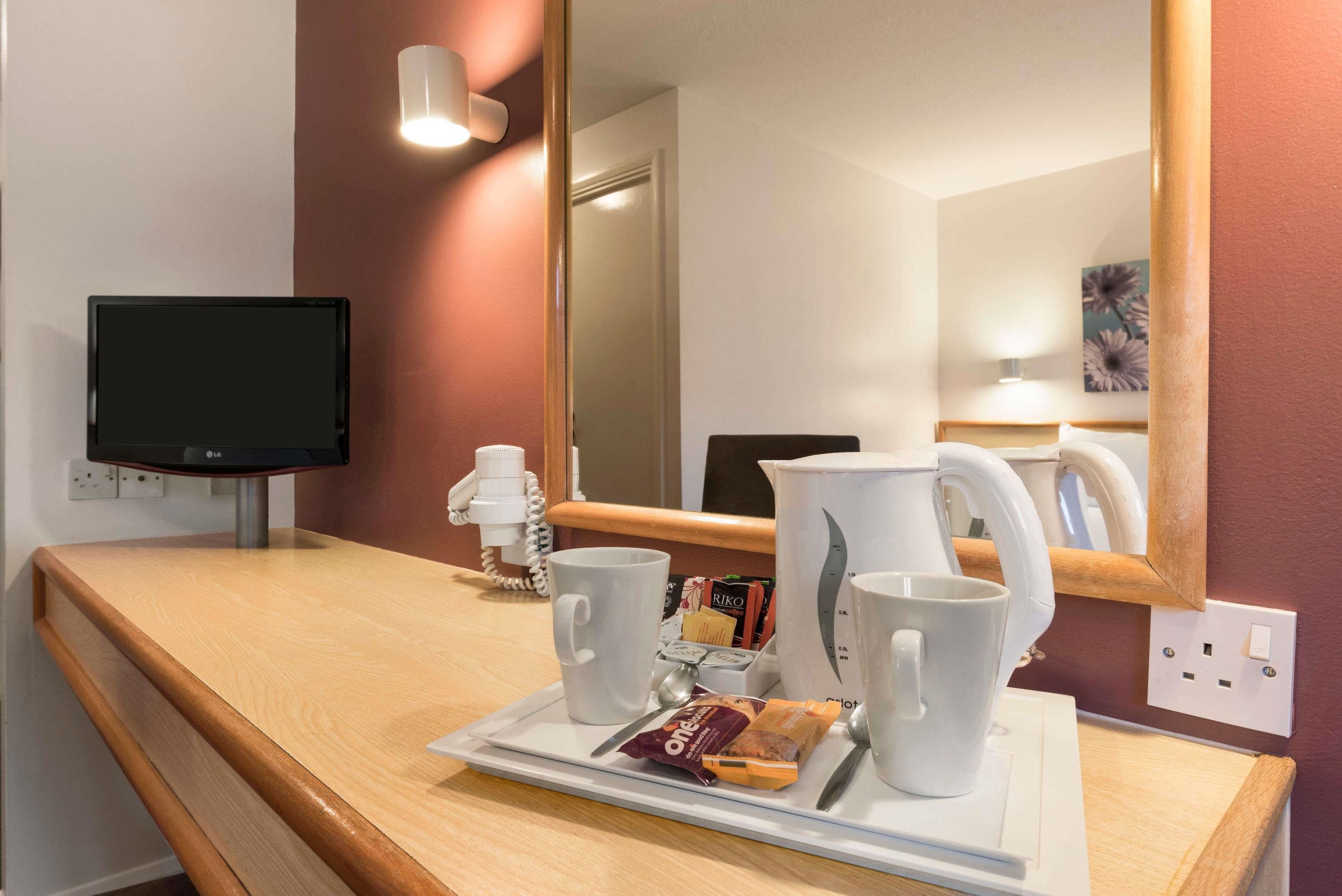 Hypo-allergenic bedding, desk, blackout drapes, iron/ironing board