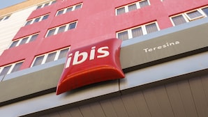 A hotel building with a prominent 'ibis' sign and 'Teresina' written below. - Ibis Teresina (Teresina)