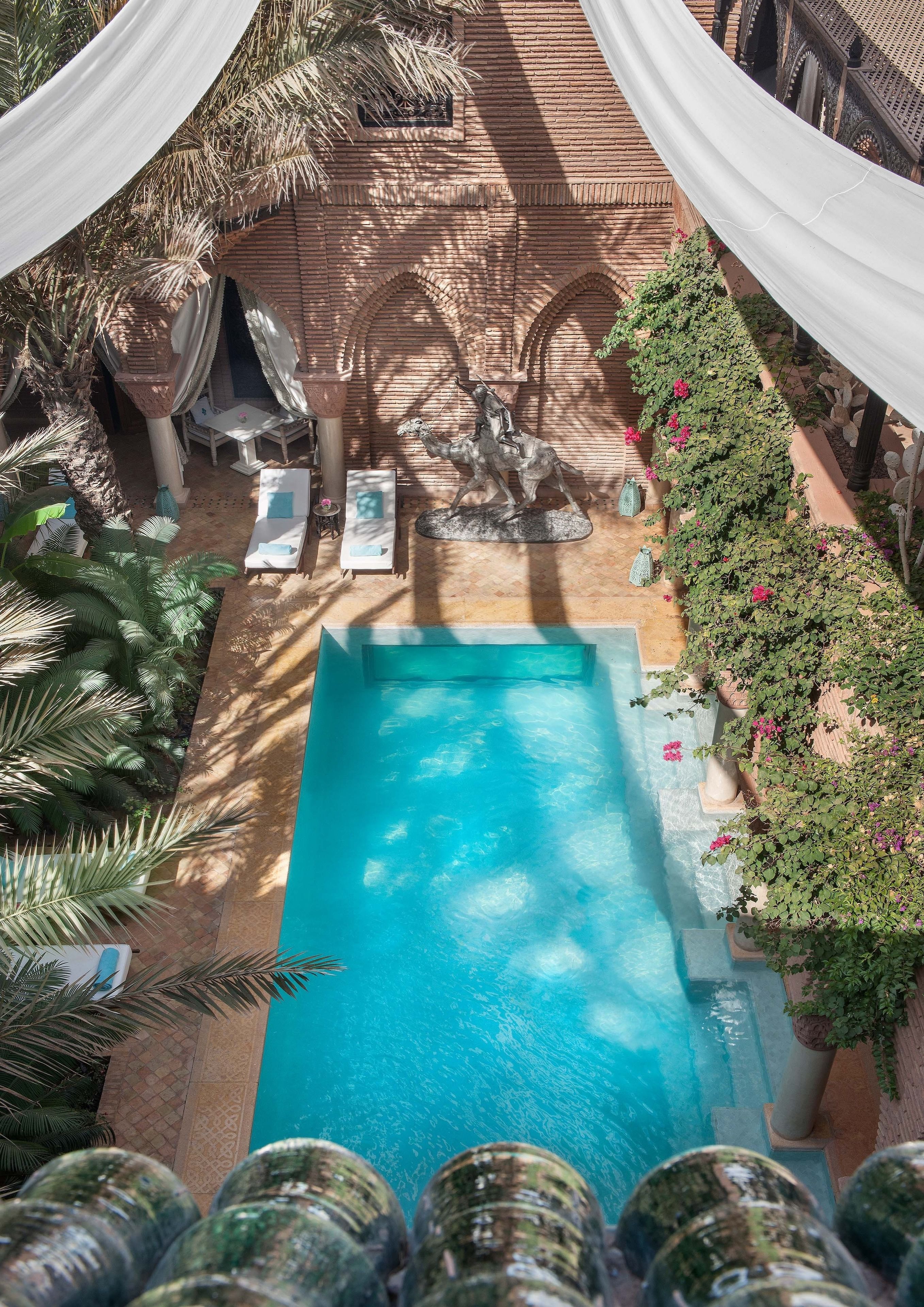 indoor pool, outdoor pool, pool umbrellas, pool loungers