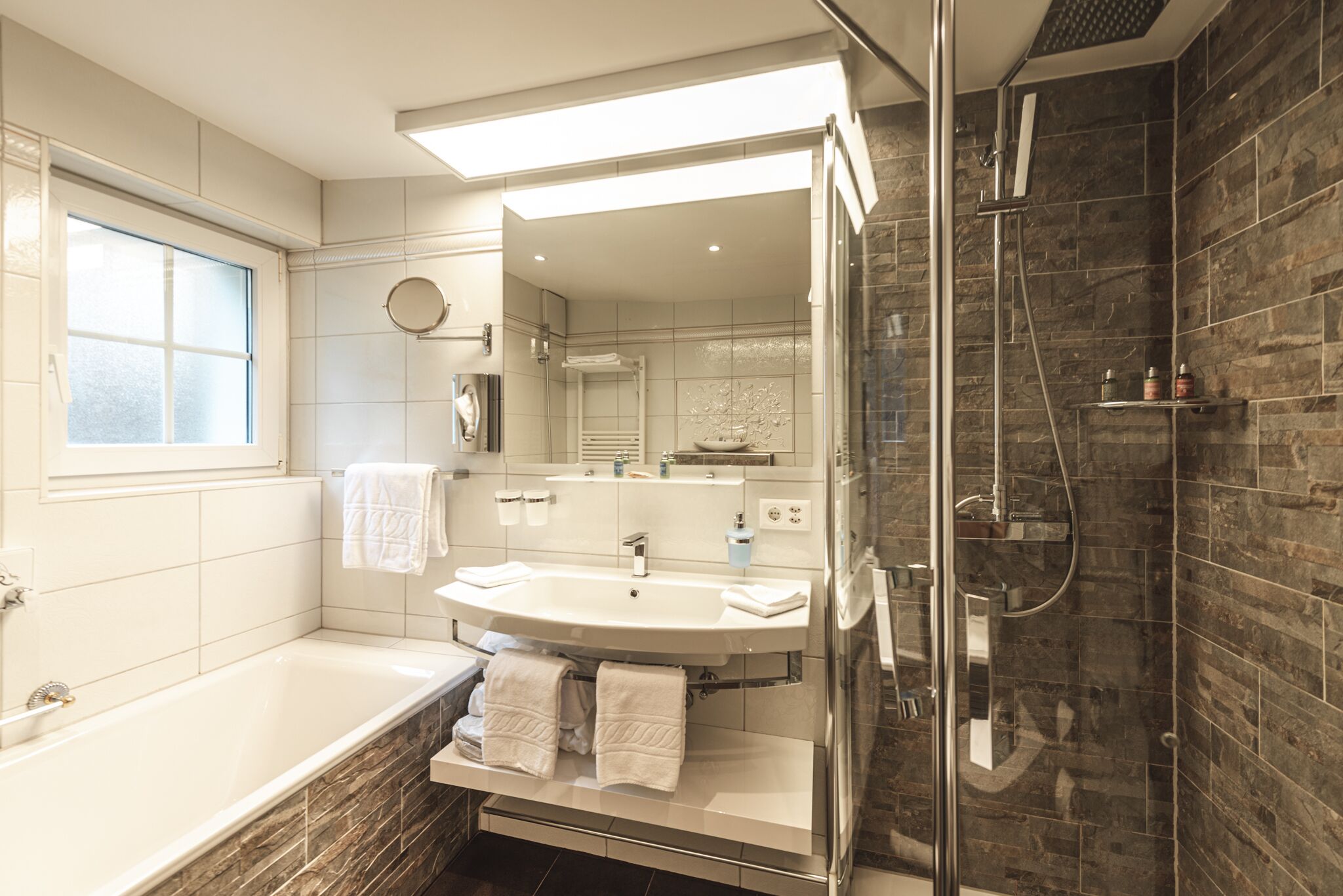 junior suite | bathroom | jetted bath, free toiletries, hair dryer, bathrobes
