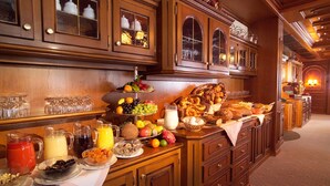 A breakfast buffet with various food items and beverages.
